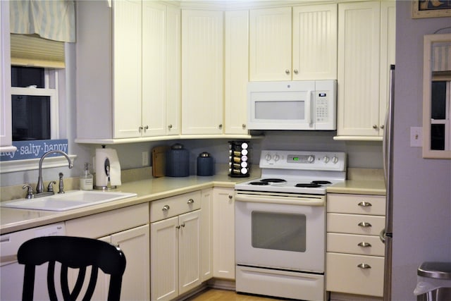 kitchen with sink and white appliances