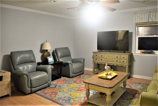 living room featuring ceiling fan, hardwood / wood-style floors, and ornamental molding