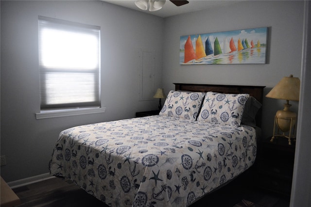 bedroom featuring ceiling fan and dark wood-type flooring