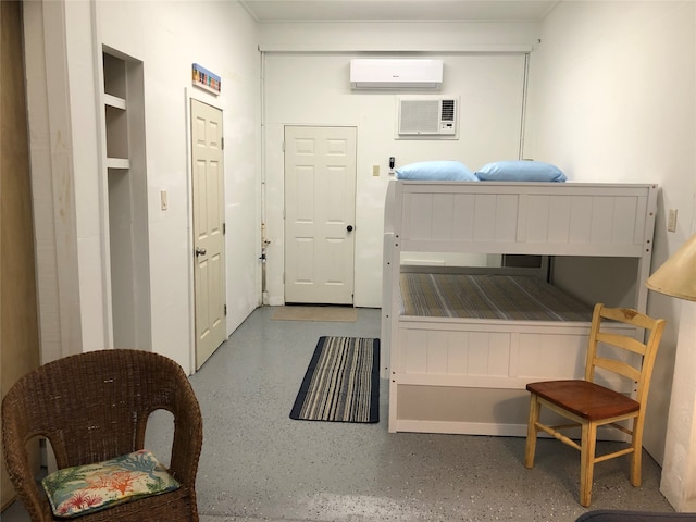 bedroom with an AC wall unit