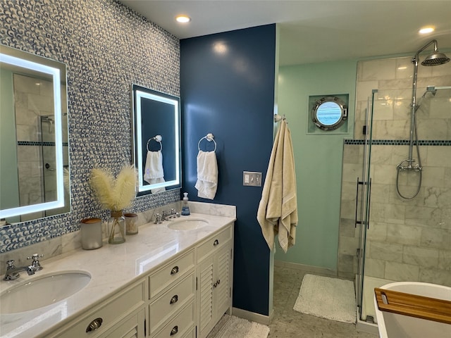 bathroom featuring tile patterned floors, a shower with shower door, and vanity