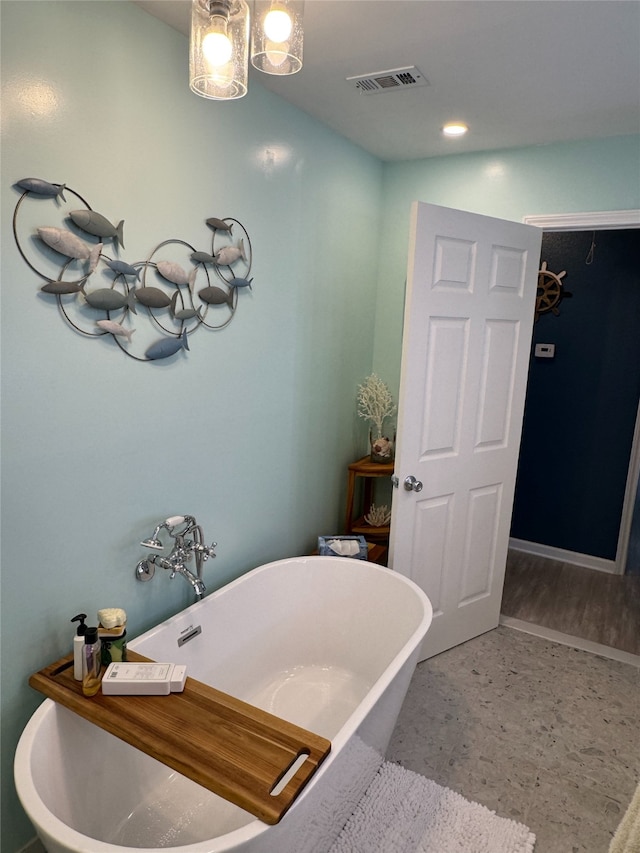 bathroom featuring a tub