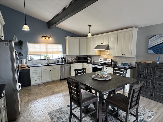 kitchen featuring stainless steel appliances, white cabinets, hanging light fixtures, and sink