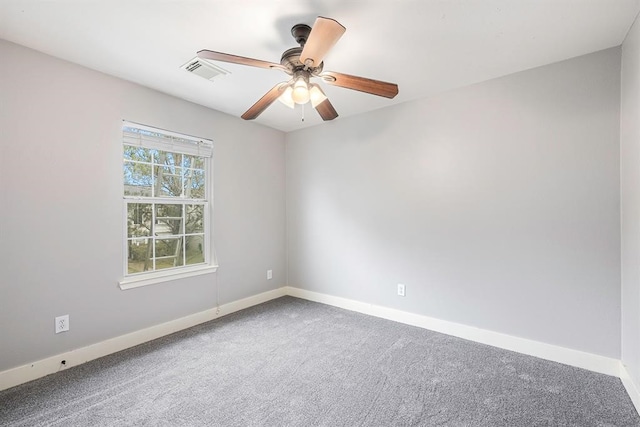 empty room with ceiling fan and carpet floors