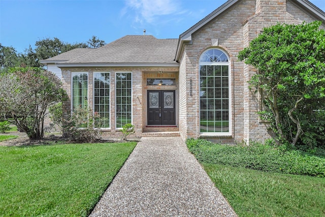 view of front facade featuring french doors and a front yard