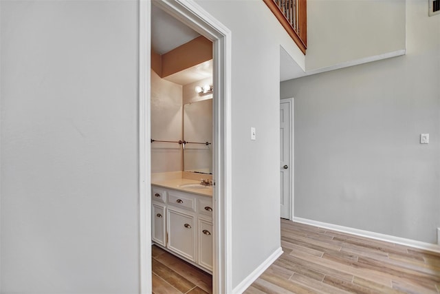 bathroom with vanity and hardwood / wood-style flooring