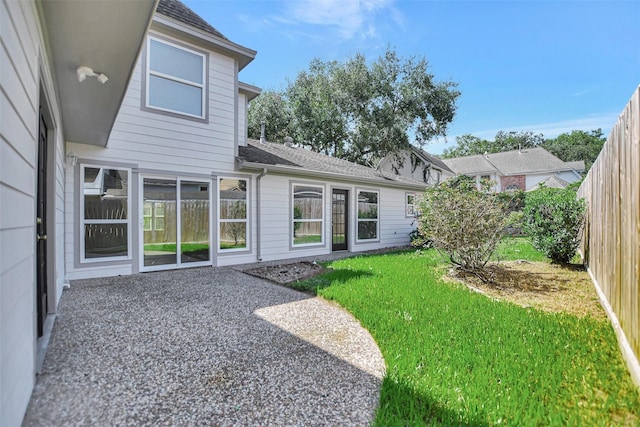 rear view of house with a lawn