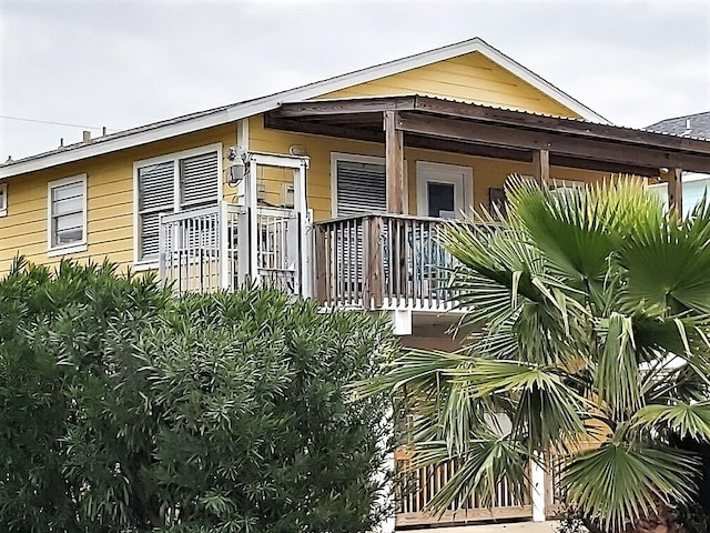 view of property exterior featuring a porch