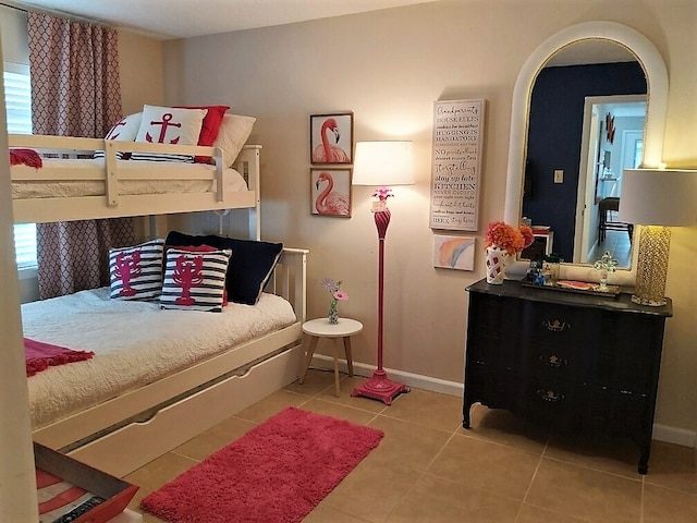 bedroom with light tile patterned floors