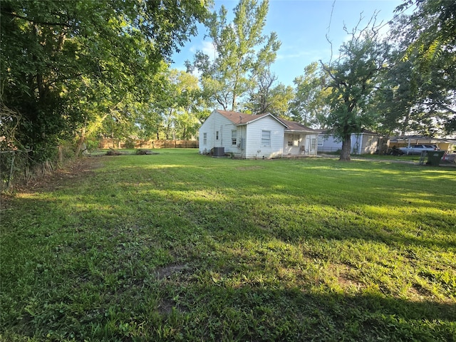 view of yard with central air condition unit