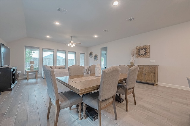 dining space featuring lofted ceiling, light hardwood / wood-style floors, and ceiling fan