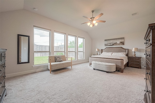 bedroom featuring multiple windows, ceiling fan, and vaulted ceiling