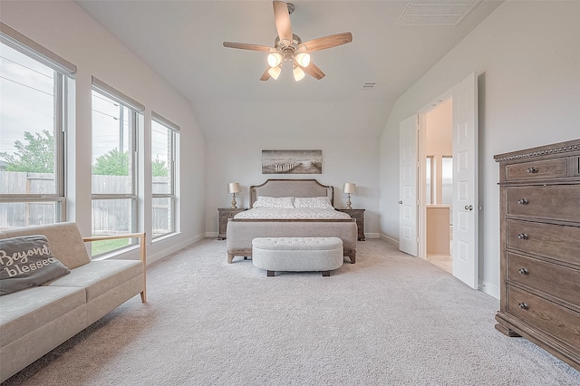 bedroom with light carpet, lofted ceiling, and ceiling fan