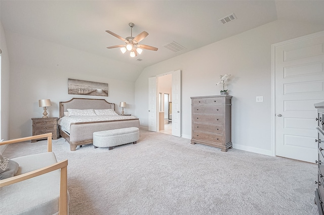 bedroom with ceiling fan, light colored carpet, and vaulted ceiling