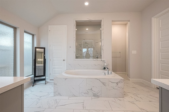 bathroom with vanity, vaulted ceiling, and shower with separate bathtub