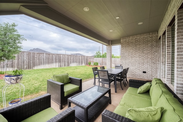 view of patio / terrace featuring an outdoor living space and a water view