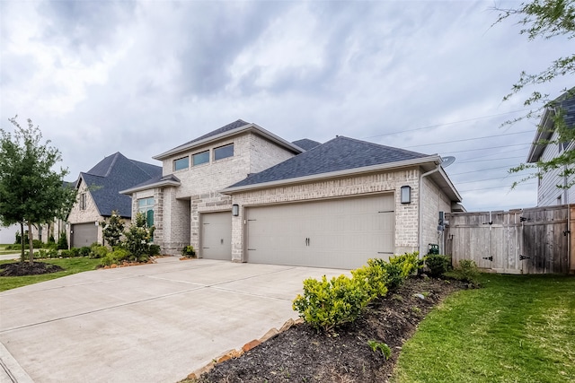 view of front of home featuring a front yard and a garage