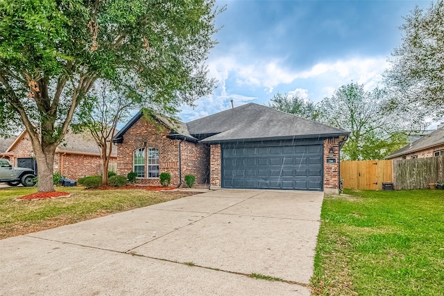 ranch-style house featuring a garage and a front yard