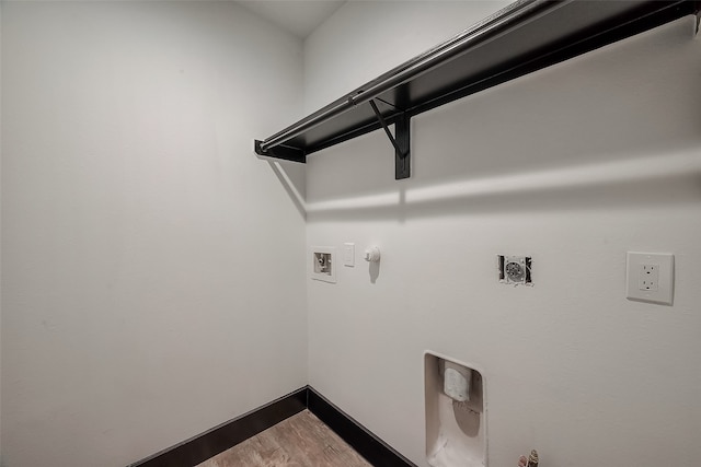 laundry room featuring hardwood / wood-style flooring, hookup for an electric dryer, washer hookup, and gas dryer hookup