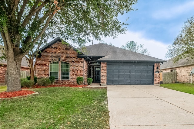 single story home featuring a front lawn and a garage