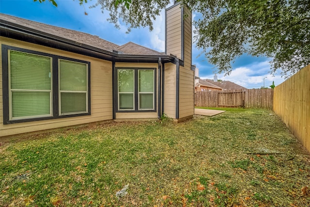 view of home's exterior with a yard