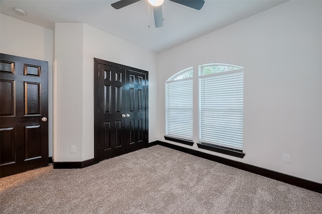 interior space with ceiling fan