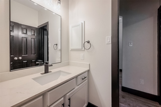 bathroom featuring vanity and hardwood / wood-style flooring