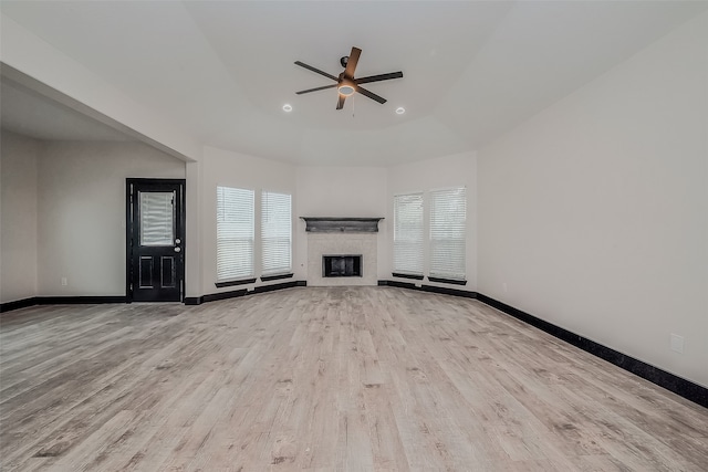 unfurnished living room featuring light hardwood / wood-style floors and ceiling fan