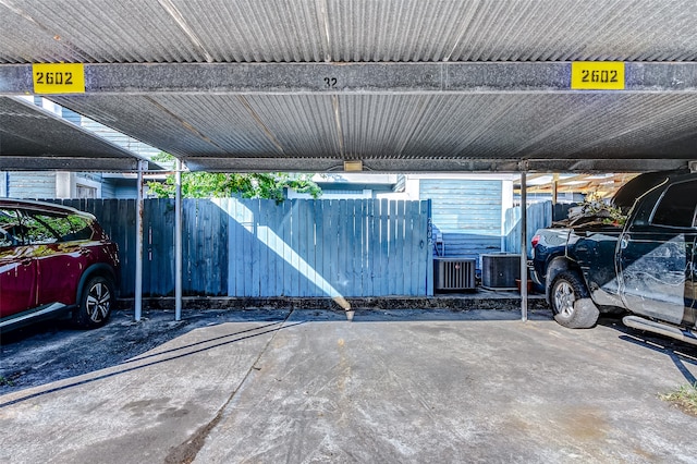 garage with cooling unit and a carport