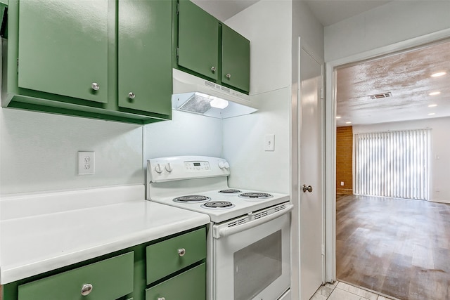 kitchen with light hardwood / wood-style floors, green cabinets, and electric range