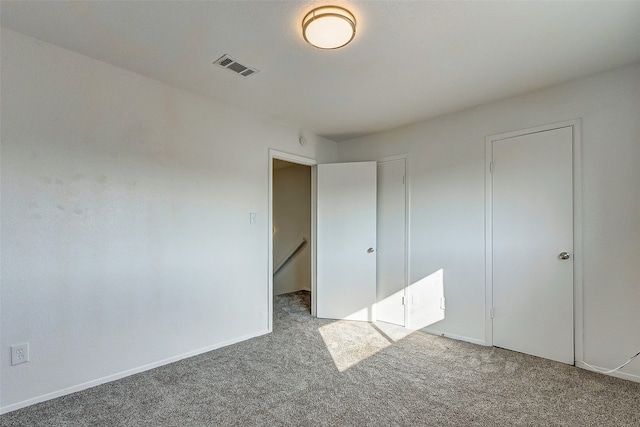 unfurnished bedroom with carpet