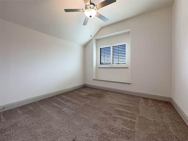 unfurnished room featuring ceiling fan, carpet flooring, and lofted ceiling