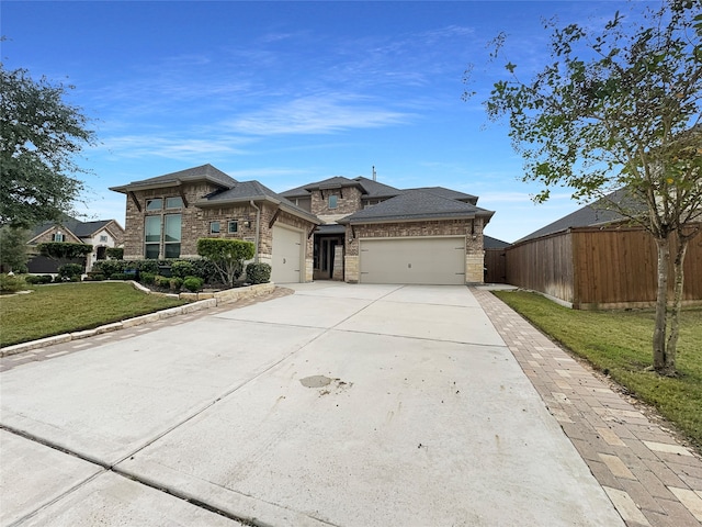 view of front of house with a garage and a front yard