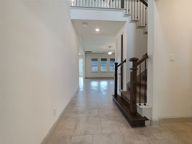 corridor with light tile patterned flooring