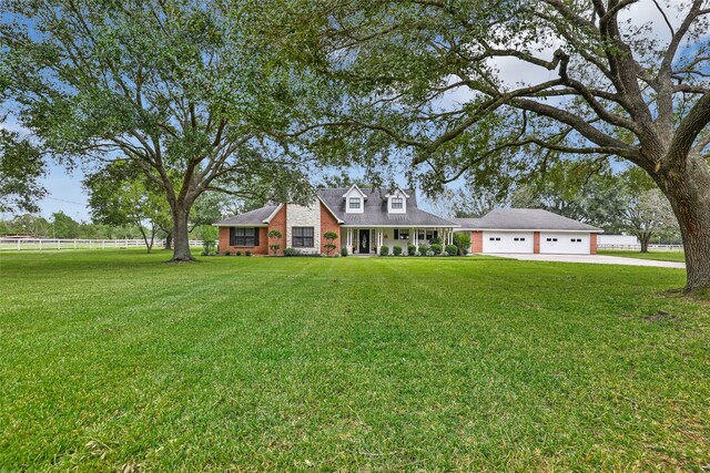 view of front facade featuring a garage and a front lawn