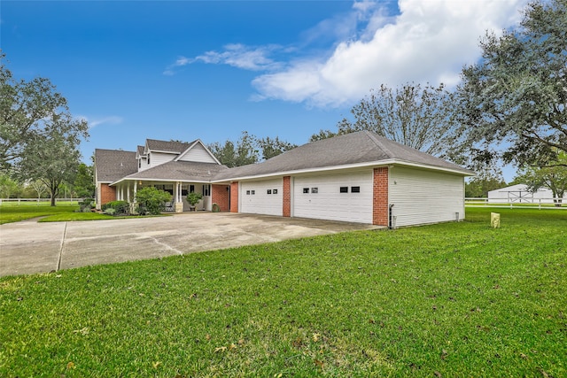 view of front of property featuring a garage and a front lawn