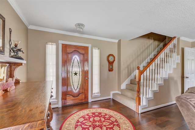 entrance foyer featuring a healthy amount of sunlight, dark hardwood / wood-style floors, and crown molding