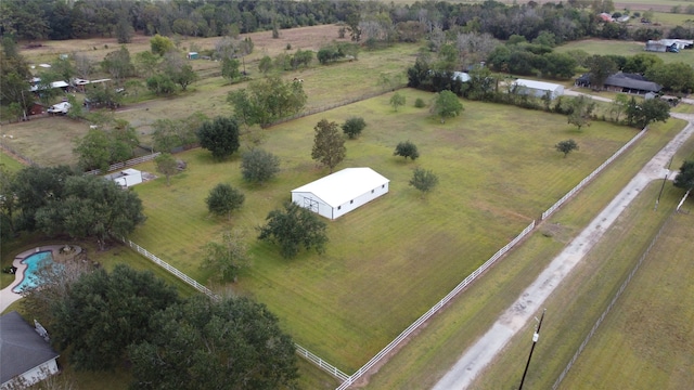 birds eye view of property with a rural view