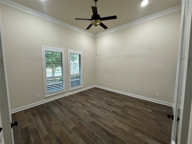 spare room featuring dark wood-type flooring, ceiling fan, and ornamental molding