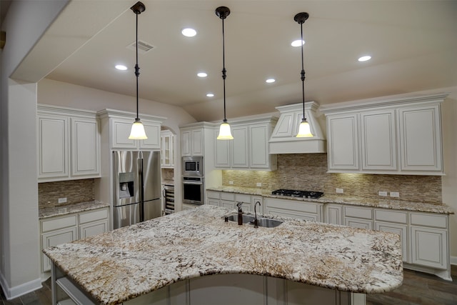 kitchen featuring a kitchen island with sink, stainless steel appliances, dark wood-type flooring, and sink