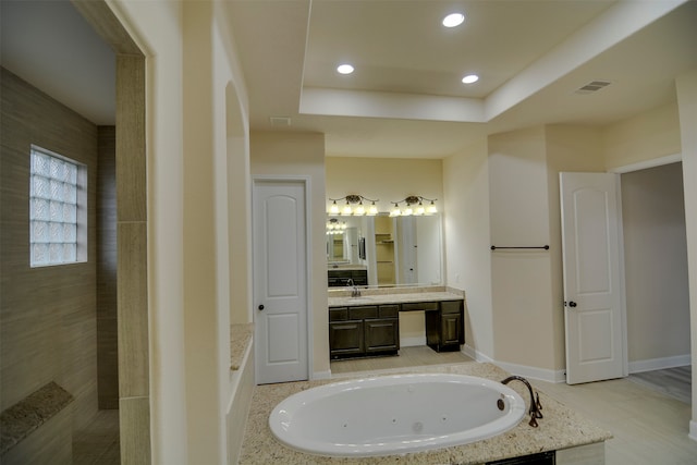 bathroom with vanity and a bathtub