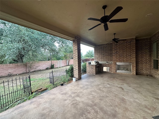 view of patio / terrace with exterior kitchen and ceiling fan