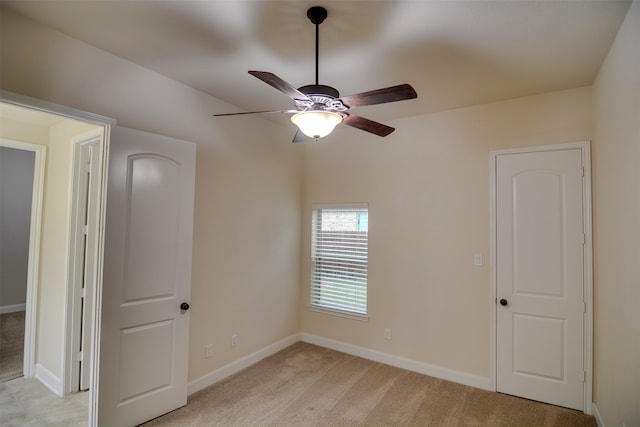 carpeted empty room with ceiling fan