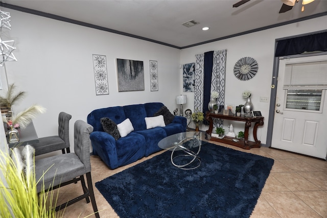 tiled living room featuring crown molding and ceiling fan