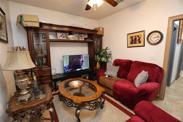 living room with light tile patterned floors and ceiling fan