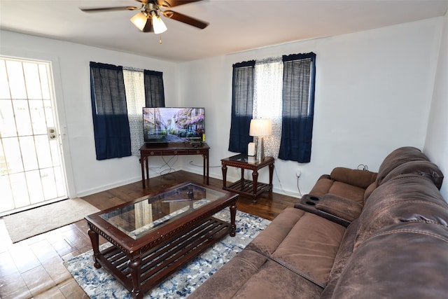 living room featuring hardwood / wood-style floors and ceiling fan