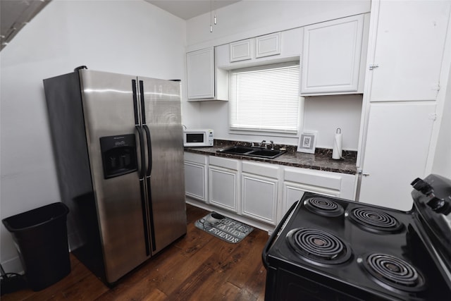 kitchen with black range with electric cooktop, sink, stainless steel fridge with ice dispenser, and white cabinetry