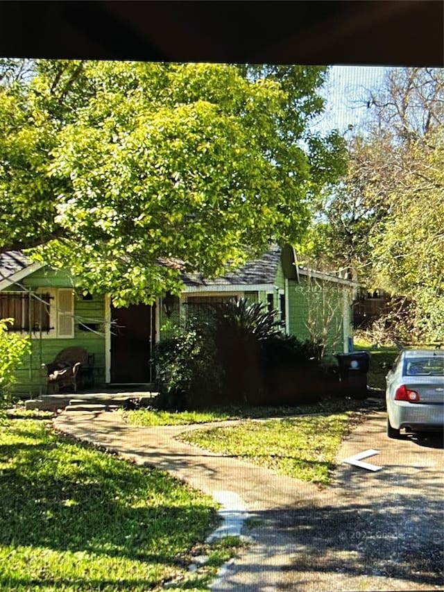 exterior space with a front lawn