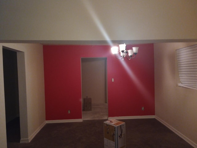 unfurnished living room with a notable chandelier