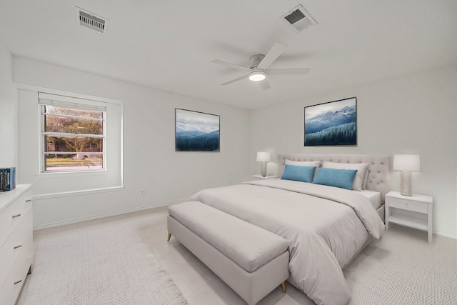 bedroom featuring light colored carpet and ceiling fan